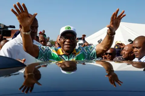 Rogan Ward/REUTERS Former South African President Jacob Zuma gestures after voting during the South African elections, in Nkandla, South Africa, 29 May 2024. 