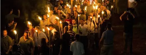 Getty Images White nationalists march through the University of Virginia Campus with torches in Charlottesville, USA. August, 2017