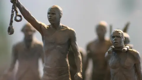 Getty Images A maquette of a statue commemorating the enslaved Africans whose lives were lost during the slave trade is pictured as it is unveiled by Boris Johnson in central London, on August 18, 2008