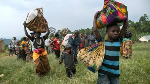 Getty Images Congolese families fleeing to Uganda