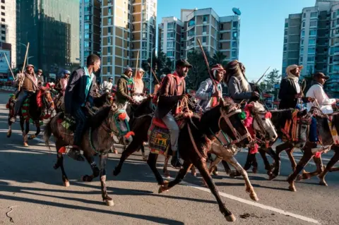 AFP Horsemen trot through Ethiopia's capital Addis Ababa.