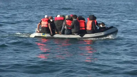 BBC Migrants in small boat in English Channel