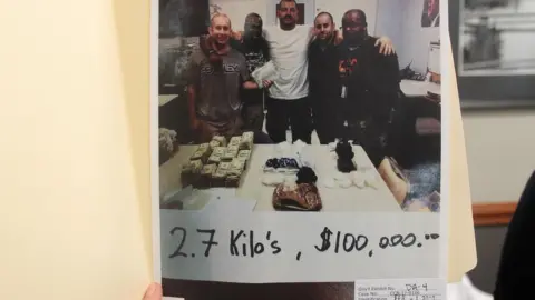 BBC Jenkins and his crew pose with 2.7 kilos of drugs