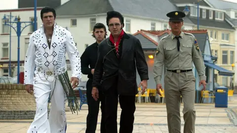 Getty Images Elvis impersonators take a walk on the seafront ahead of the events at the 2005 Porthcawl Elvis Festival