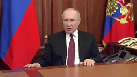 Reuters Vladimir Putin announcing the military action in Ukraine on Russian TV