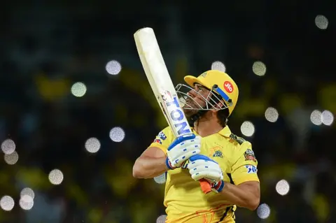 Getty Images Chennai Super Kings' captain Mahendra Singh Dhoni watches the ball after playing a shot during the Indian Premier League (IPL) Twenty20 cricket match between Chennai Super Kings and Lucknow Super Giants at the MA Chidambaram Stadium in Chennai on April 3, 2023. (