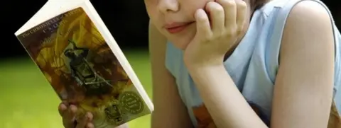 PA Boy reading novel