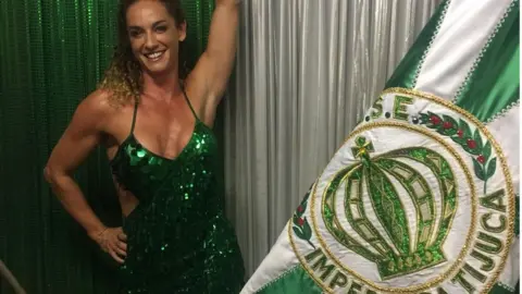 Imperio da Tijuca/ Geissa Evaristo Samantha Mortner poses with the Imperio da Tijuca flag