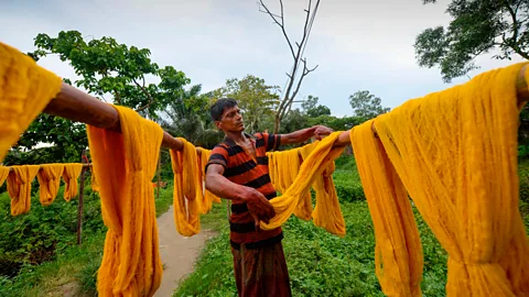 Getty Images The dye that is added to clothing also needs to be removed before it the yarn can be recycled (Credit: Getty Images)