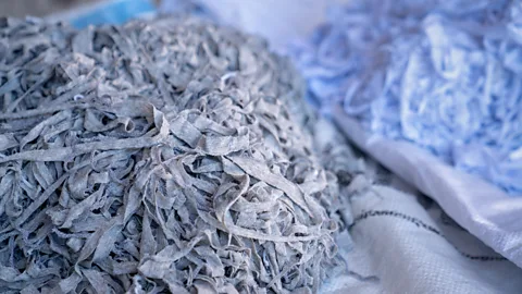 Alamy The shredding process used by mechanical recycling methods leads to shorter, weaker fibres that cannot be resued to make clothes (Credit: Alamy)