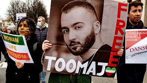 Getty Images The rapper Toomaj Salehi, who emerged as the embodiment of a defiant generation, was arrested in 2022 and charged with "corruption on Earth" (Credit: Getty Images)
