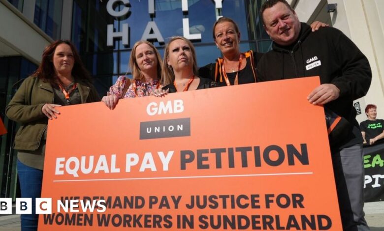 131080333 paynewplacardoutsidecouncil.jpg