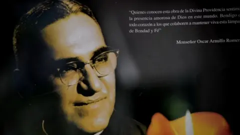 AFP Picture of a banner with a portrait of Archbishop Oscar Arnulfo Romero taken at La Divina Providencia Chapel in San Salvador on March 21, 2011.
