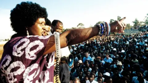 AFP A picture taken on April 13, 1986 shows Winnie Madikizela-Mandela, then-wife of South African president Nelson Mandela, addressing a meeting in Kagiso township.