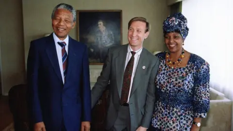 Courtesy Gary Bedell Nelson Mandela, Gary Bedell, and Winnie Mandela