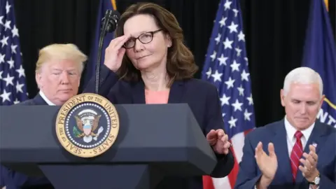 Getty Images Gina Haspel prepares to give a speech after her swearing-in, flanked by US President Donald Trump and Vice President Mike Pence