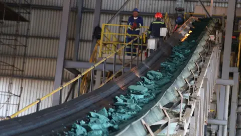 Getty Images A conveyor belt carries chunks of raw cobalt after initial processing at a plant in Lubumbashi, Democratic Republic of Congo, before being exported to be refined.