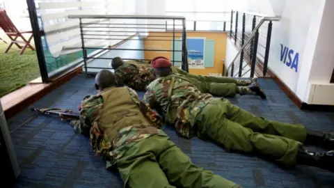 Reuters Members of security forces secure a building at the scene where explosions and gunshots were heard at the Dusit hotel compound, in Nairobi, Kenya January 15, 2019.