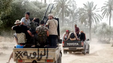 AFP Armed militiamen on trucks in Tripoli, Libya - June 2019