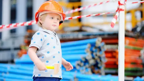 Getty Images/SbytovaMN Boy dressed as builder