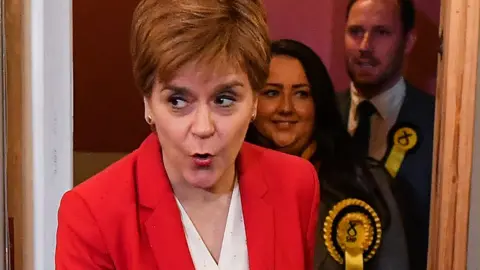 Getty Images Nicola Sturgeon arrives at a campaign event at a nursery
