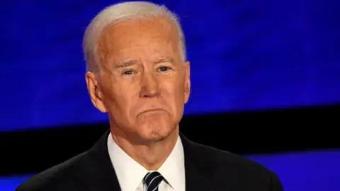Getty Images Joe Biden at a presidential debate in Iowa