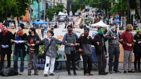 EPA Activists form a wall in an effort to keep out and disruptive protestor in the "Occupied Protest"