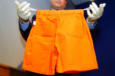 PA Media Police displayed a pair of shorts similar to those found on Adam's torso in the River Thames, January 2002