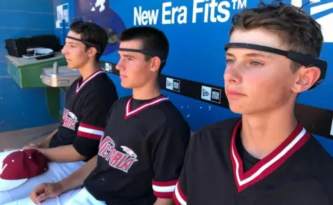 InteraXon Young baseball players using Muse headbands