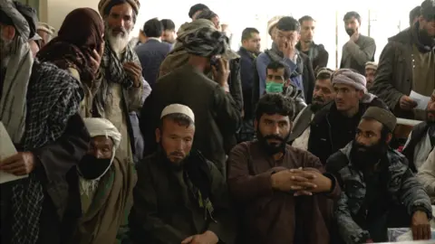 BBC Crowds gather outside the cancer ward in Kabul