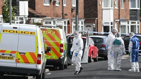 Getty Images Scene of crime officers