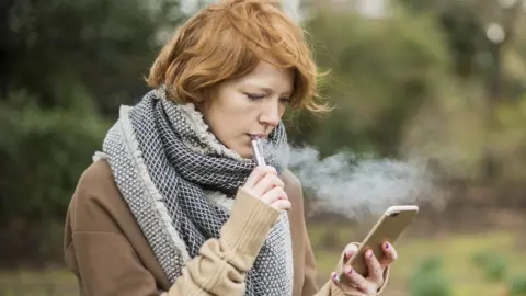 Getty Images Woman with vape