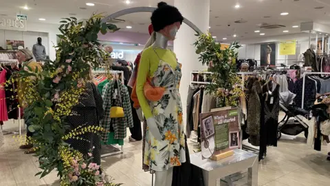 Chelsea Coates BBC A shop display for Emmaus in Charity Super.Mkt