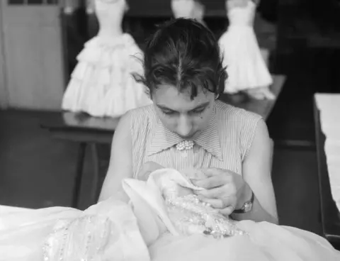 Henry Grant Collection/Museum of London Dressmaking student doing hand embroidery at Shoreditch College, 1958