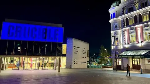 Sheffield Theatres Sheffield Crucible with a blue sign