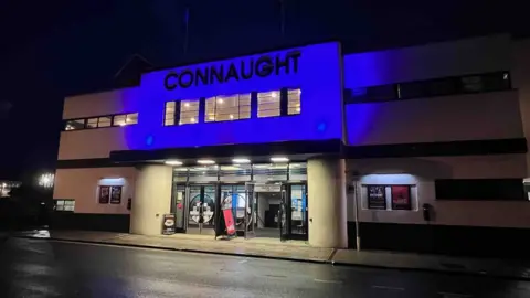 Worthing Theatres Worthing Connaught Theatre lit blue
