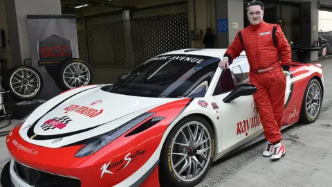 Getty Images GREATER NOIDA, INDIA - FEBRUARY 12: Gautam Singhania, Chairman and MD Raymond Ltd, during Ferrari 458 Challenge at Buddh International Circuit in Greater Noida on Tuesday. (Photo by K Asif/The India Today Group via Getty Images)