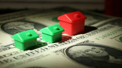 Getty Images Monopoly houses on dollar bills