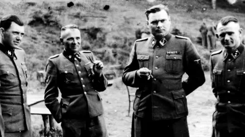 Getty Images Josef Mengele pictured (left) with other senior Nazi officers