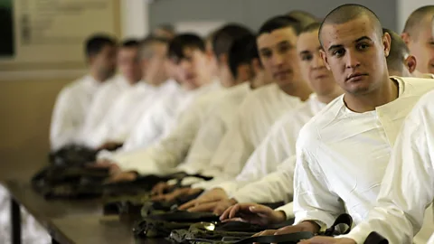 Getty Images Russian conscripts get their military uniforms at the military enlistment office in the city of Krasnodar in 2011 (Credit: Getty Images)