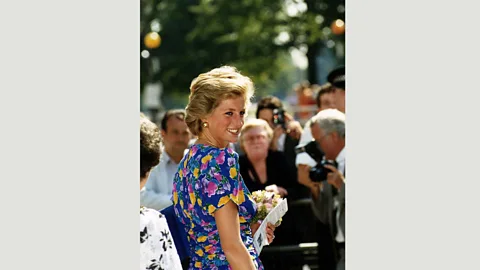 Alamy David Sassoon’s 1988 blue dress with printed flowers was named by the princess her ‘caring’ dress because children loved it (Credit: Alamy)
