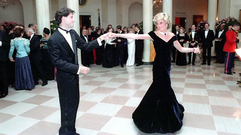 Alamy Dancing with John Travolta in 1985 in a sweeping Victor Edelstein velvet dress was a bold statement of glamour and independence (Credit: Alamy)