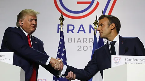 Getty Images It often appears more like an arm wrestle than a handshake when Donald Trump and Emmanuel Macron are together (Credit: Getty Images)