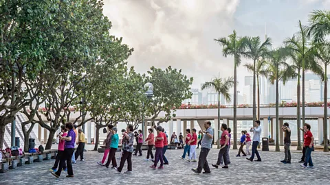 Marc Bruxelle/Alamy Hong Kong’s elderly citizens are encouraged by the government to attend morning tai chi classes (Credit: Marc Bruxelle/Alamy)