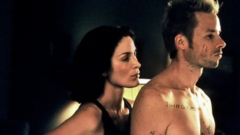 Alamy Several of Nolan’s films – including Memento, which starred Guy Pearce and Carrie-Anne Moss – depend on wholly cinematic techniques (Credit: Alamy)
