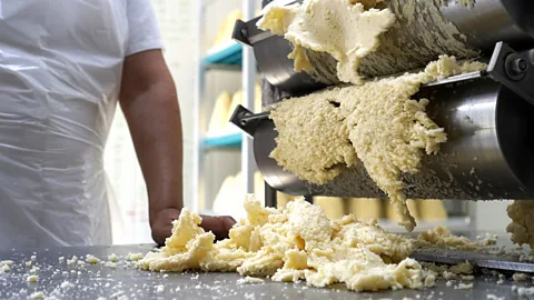 Linni Kral Dried cow's milk curd is fed through a rabilar (Credit: Linni Kral)