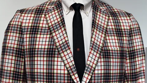 Getty Images A man's sports jacket in Madras check worn with button-down shirt and tie