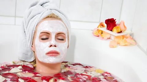 Alamy Woman in bath with flowers