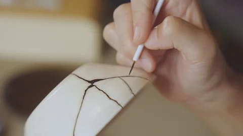 Getty Images The ancient Japanese art of kintsugi involves the visible mending of broken pottery (Credit: Getty Images)