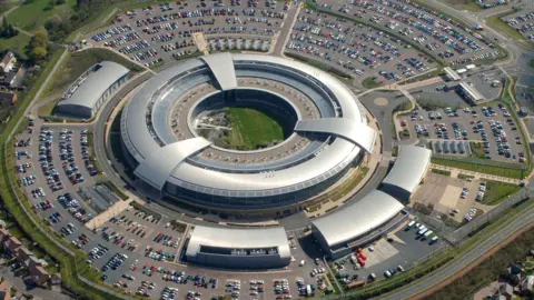 Reuters An Aerial view of the GCHQ site, known as the donut because of it's spherical shape with a hole in the middle. Many cars are seen parked on the exterior